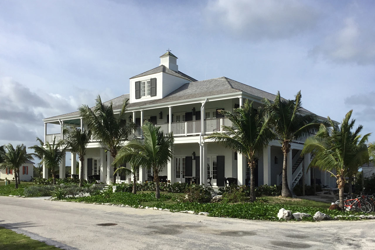 harbour view of a Bahamian veranda style lodge designed by Maria de la Guardia & Teofilo Victoria of DLGV Architects & Urbanists