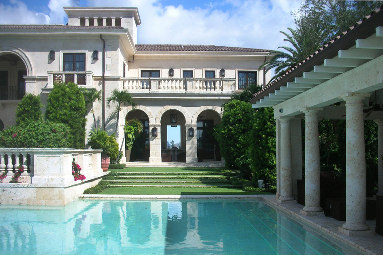 pool of a Traditional neoclassical estate accentuated with coral stone, designed by Maria de la Guardia & Teofilo Victoria of DLGV Architects & Urbanists in collaboration with Ernesto Buch