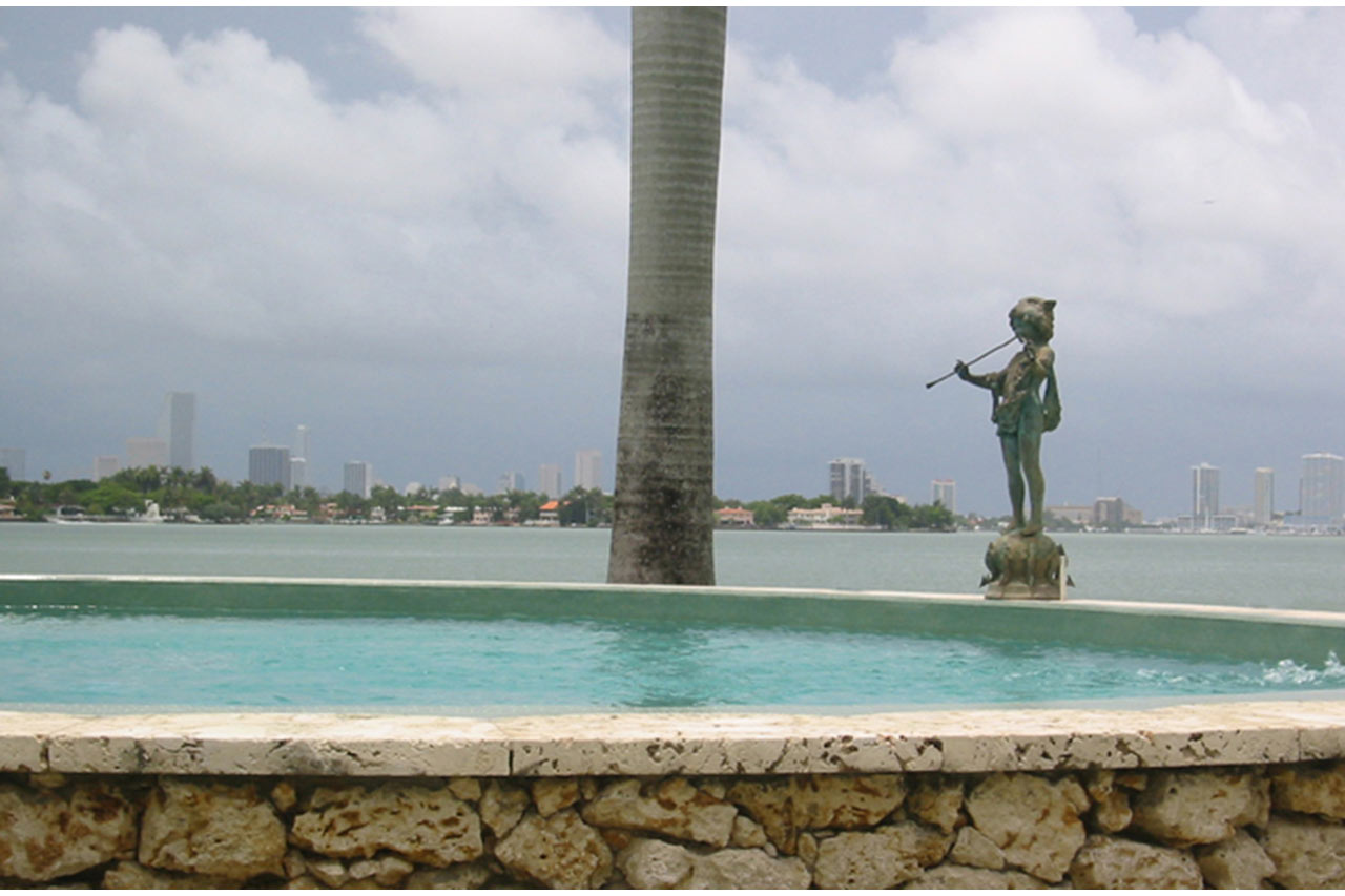 pool elevation of an Oval stone & mosaic pool in Miami Beach designed by Maria de la Guardia & Teofilo Victoria of DLGV Architects & Urbanists
