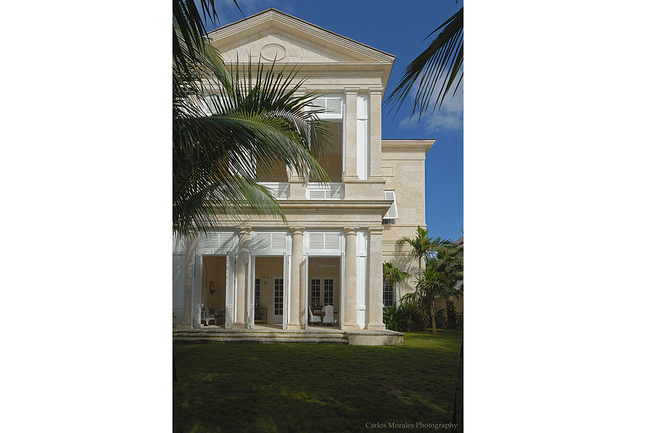 Beach Facade of a Palladian beach house in the Bahamas designed by Maria de la Guardia & Teofilo Victoria in the classical tradition built of coral stone